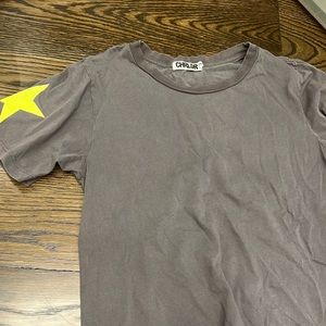 Gray woman tshirt. Yellow star on side.